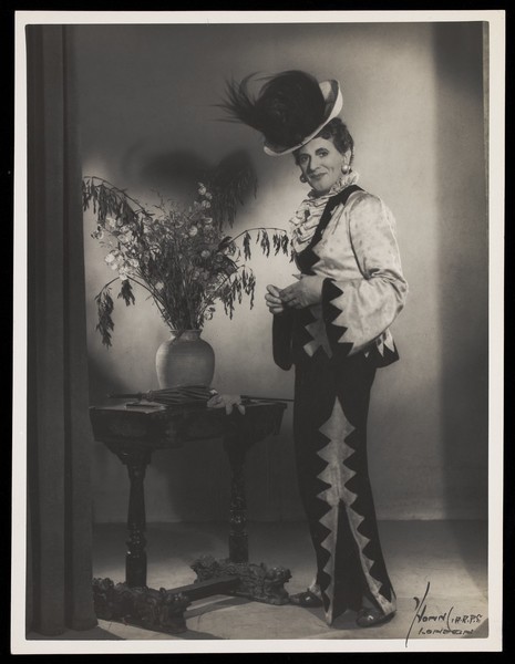 Download the full-sized image of An actor in drag, posing in a studio. Photograph by Mme Yvonne, 194-.