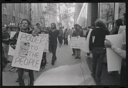 Download the full-sized image of Sylvia Rivera Holds "Power to the People" Sign at Weinstein Hall Demonstration