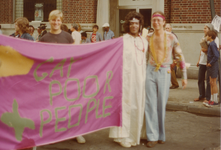 Download the full-sized image of Marsha P. Johnson Holding a Banner at the Christopher Street Liberation Day Parade, 1975