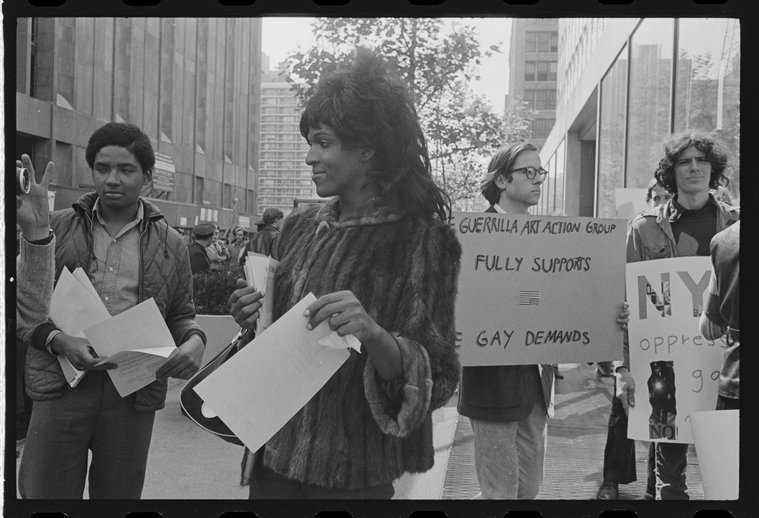 Download the full-sized image of A Photograph of Marsha P. Johnson and other Demonstrators at New York University Handing out Flyers