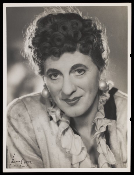 Download the full-sized image of An actor in drag, posing for a portrait. Photograph by Mme Yvonne, 194-.