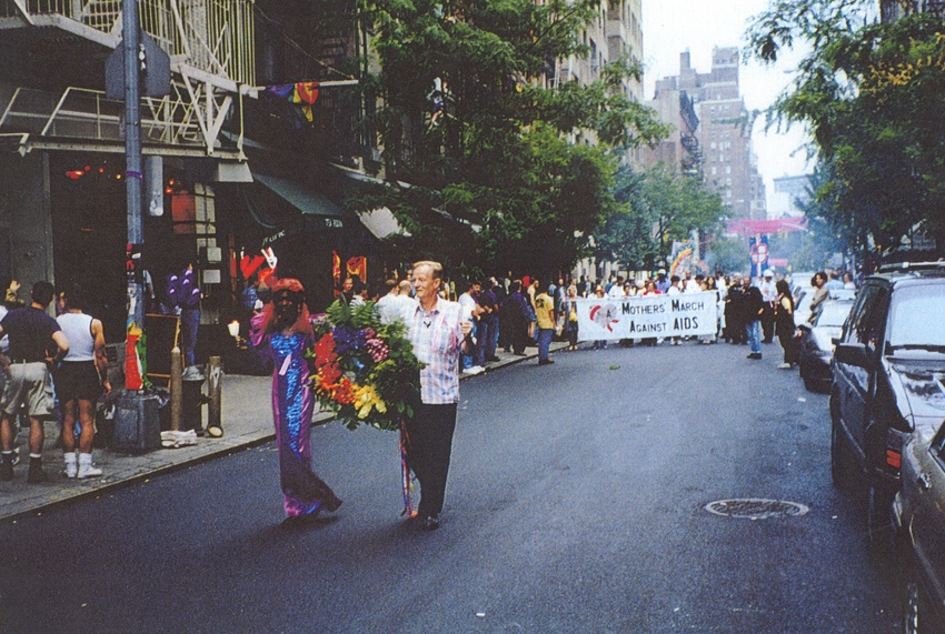 Download the full-sized image of A Photograph of Cocoa Rodriguez Carrying a Floral Wreath in a Parade