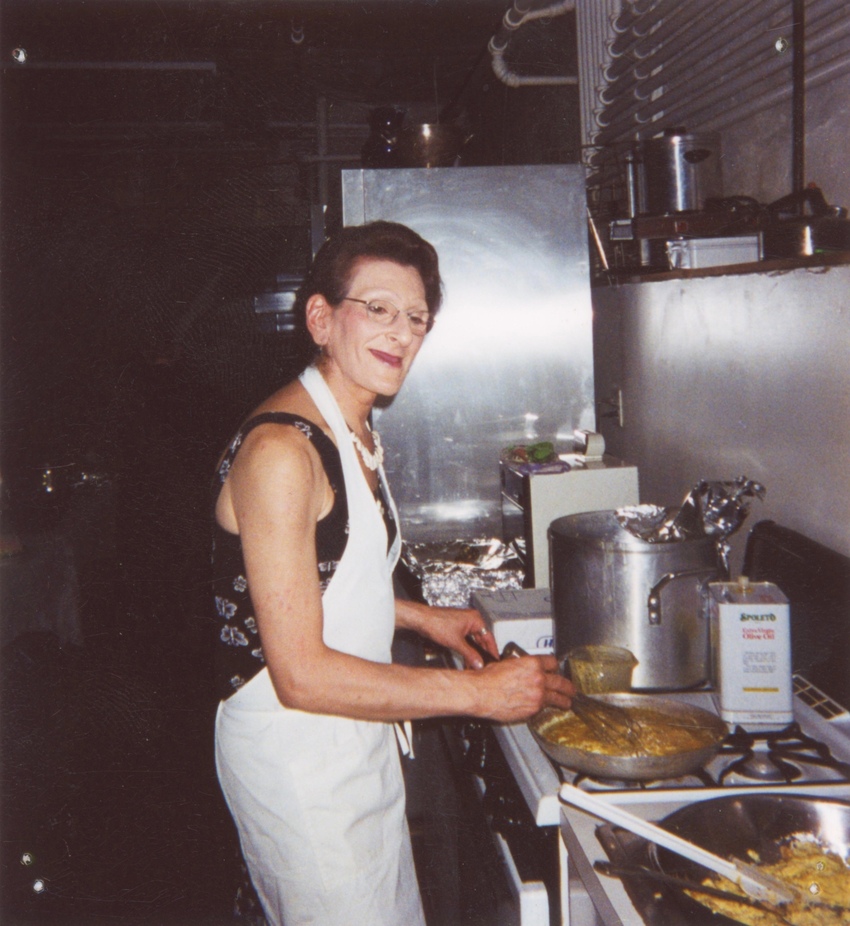 Download the full-sized image of A Photograph of Sylvia Rivera Cooking in a Kitchen