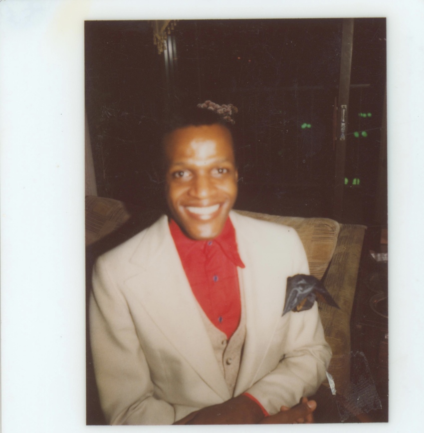 Download the full-sized image of A Photograph of Marsha P. Johnson Wearing a White Jacket and Red Button-up