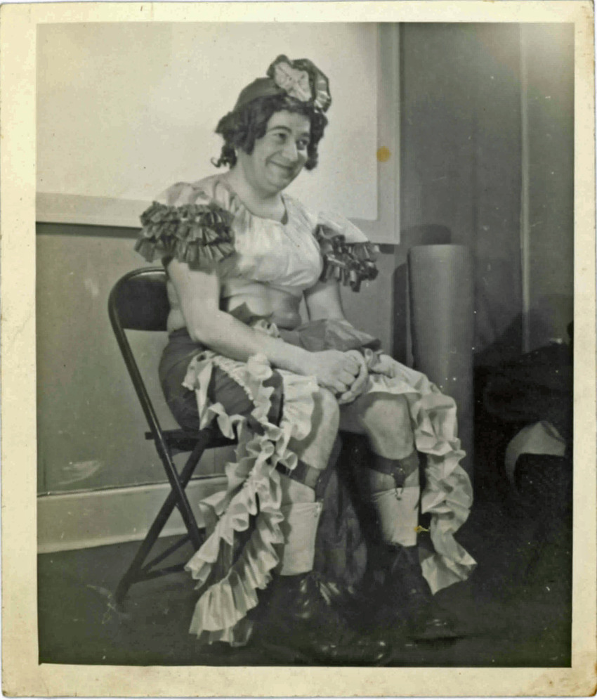 Download the full-sized PDF of A Seated Performer Poses for a Photograph