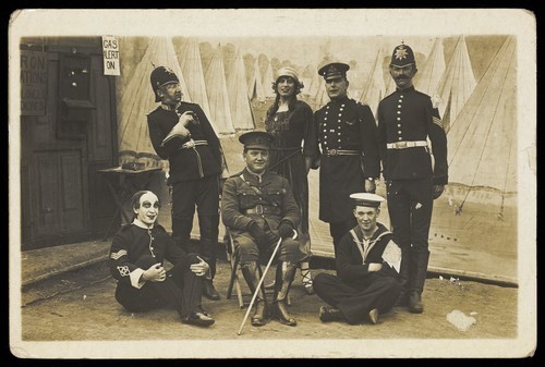 Download the full-sized image of Characters on the set of a play. Photographic postcard. 191-.