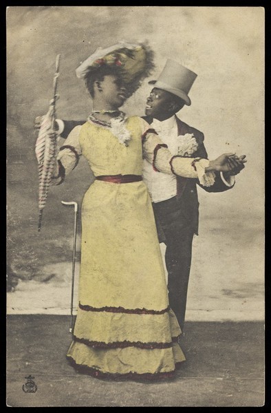 Download the full-sized image of Two black actors, one in drag, dance together on stage. Coloured process print, ca. 1903.