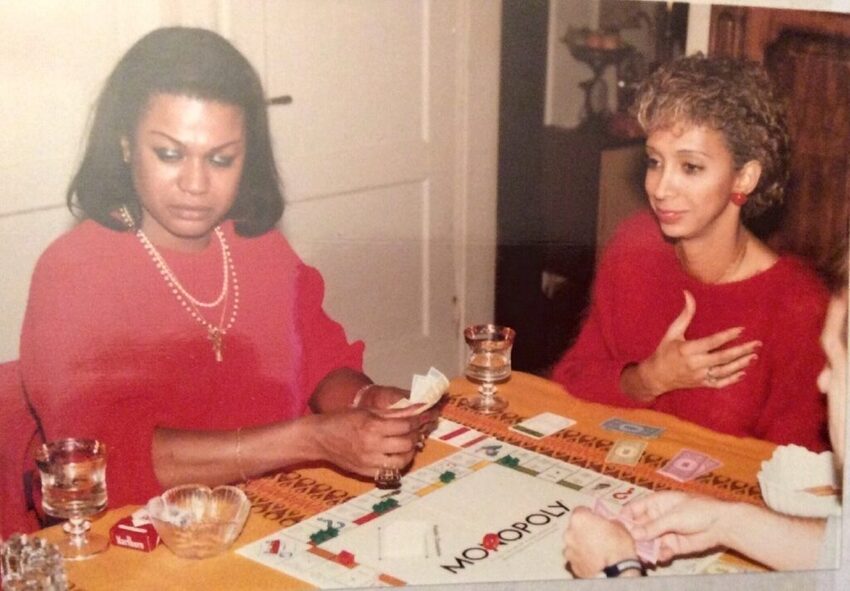 Download the full-sized image of A Photograph of Marlow Monique Dickson Playing Monopoly with a Friend
