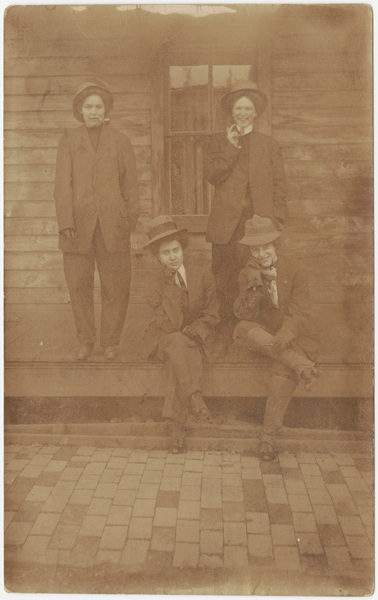 Download the full-sized image of Male impersonators in suits on porch