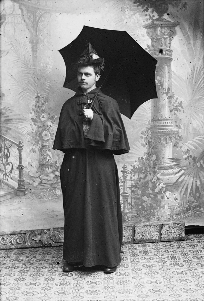 Download the full-sized image of An Unknown Person In Traditional Women's Attire Holding an Umbrella