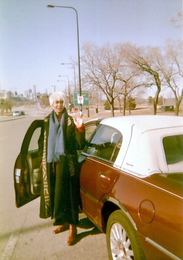 Download the full-sized image of A Photograph of Marlow Monique Dickson in front of a Car